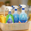 Astonish spring cleaning products in a basket with brushes and microfiber cloths – featured in Purcho’s spring cleaning checklist